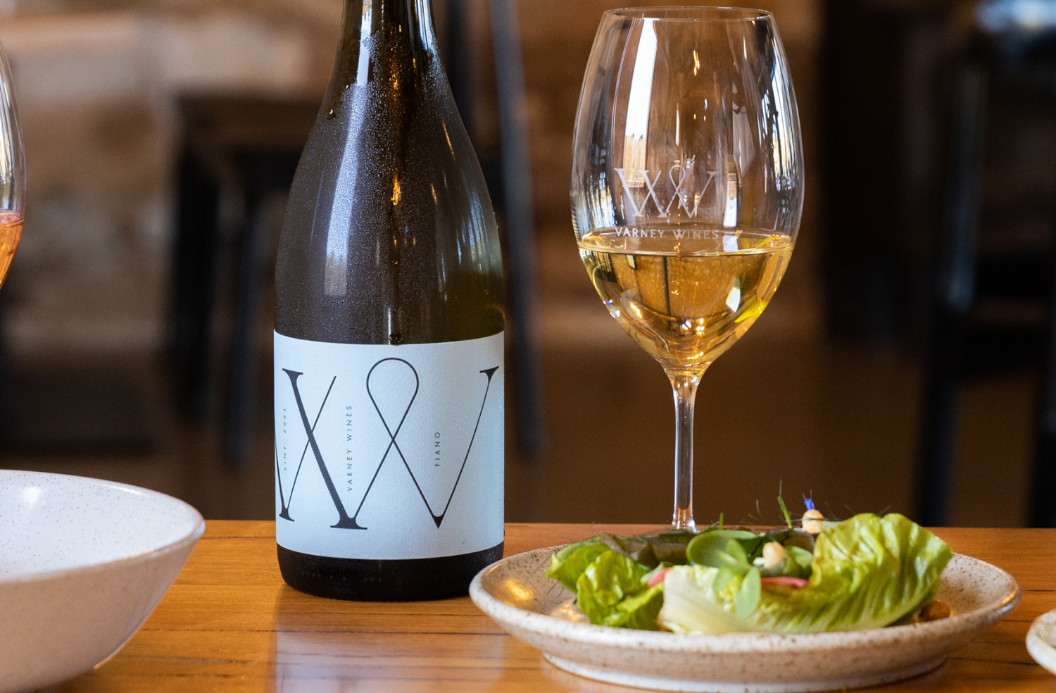 Varney Wines Fiano paired with a beautiful cashew cream salad on a beautifully set table.