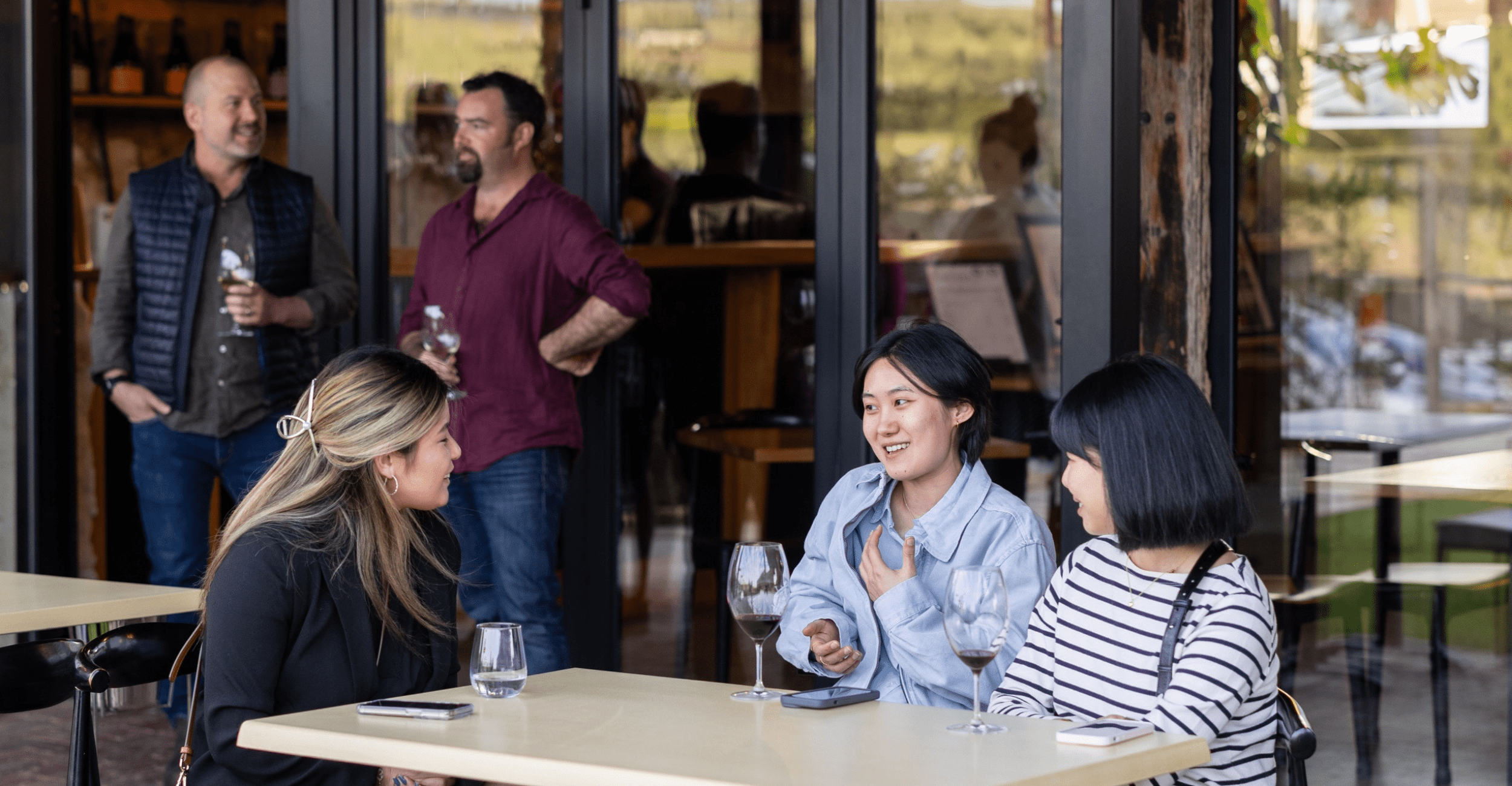Guest enjoying an outside table at the Varney Wines Tasting Room in McLaren Vale, South Australia.