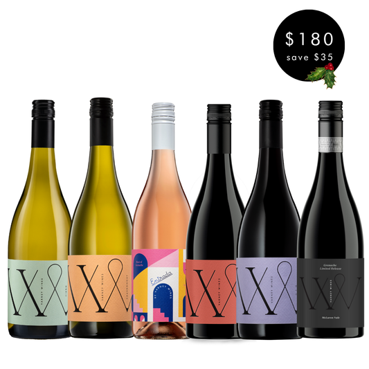 Set of six wine bottles with colorful labels on a white background, with a price tag. Varney Wines selection from South Australia.