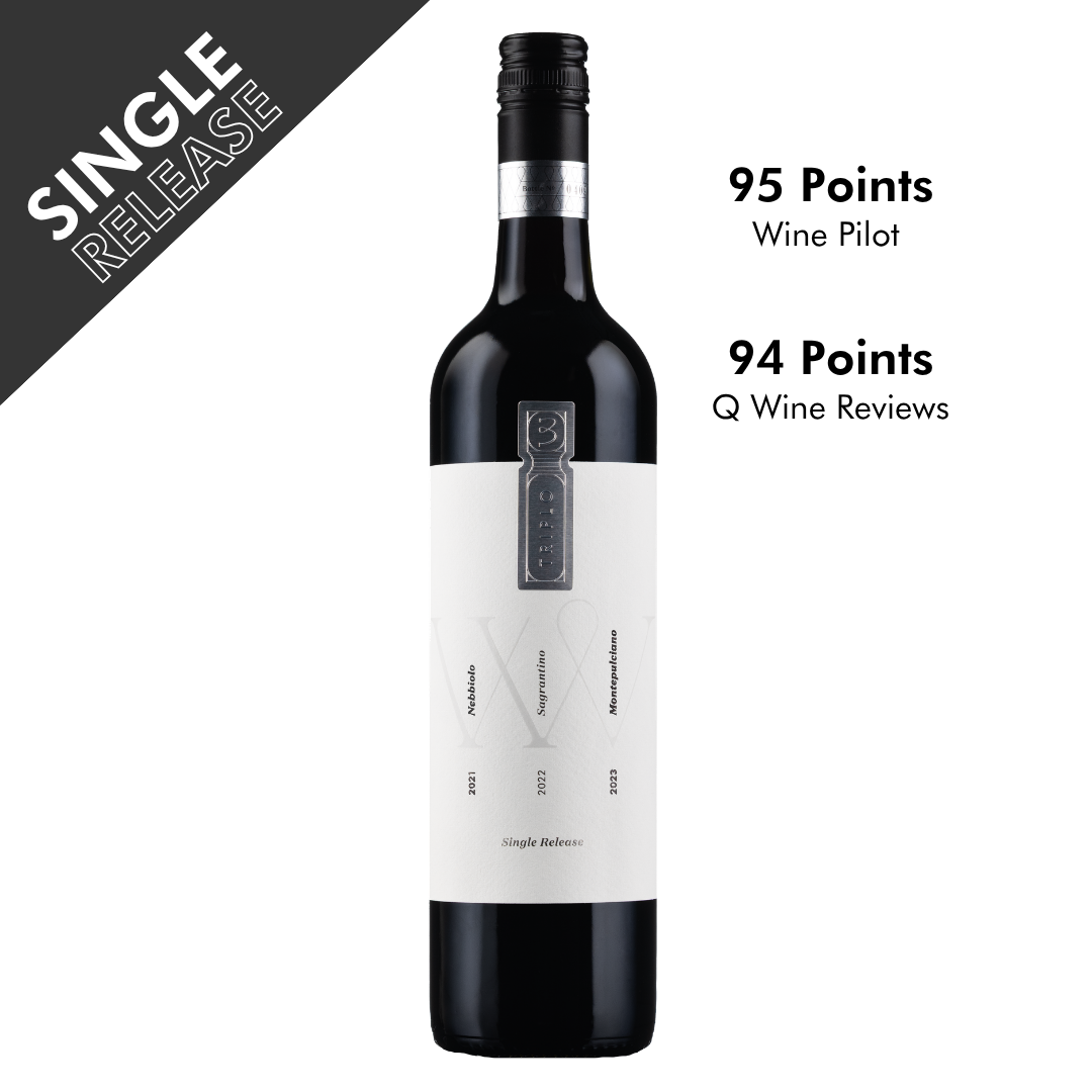 Bottle of single release triplo wine. A dark bottle with a white label and silver badge. The bottle is on a white background. There are high scores that feature.